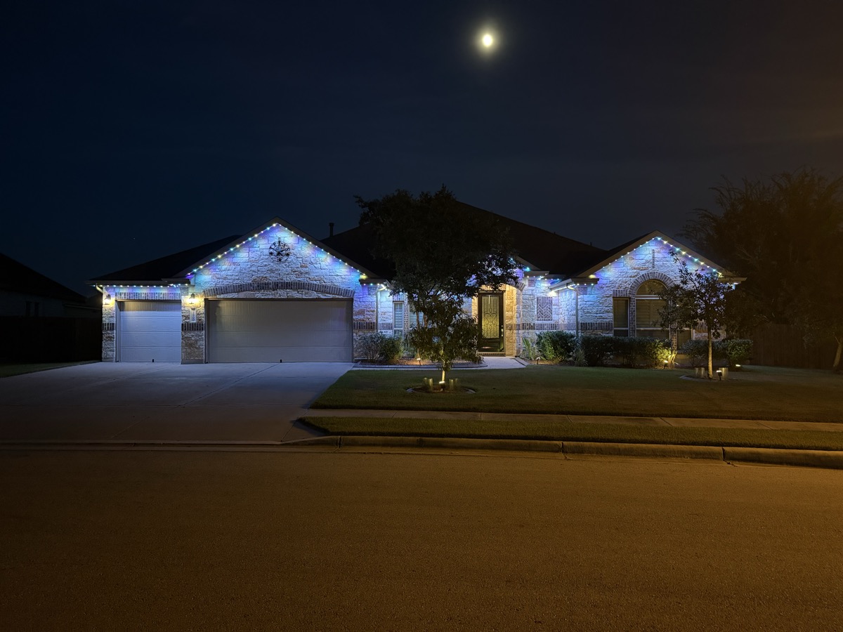 Austin ranch-style home with permanent LED motion sensor lighting at night